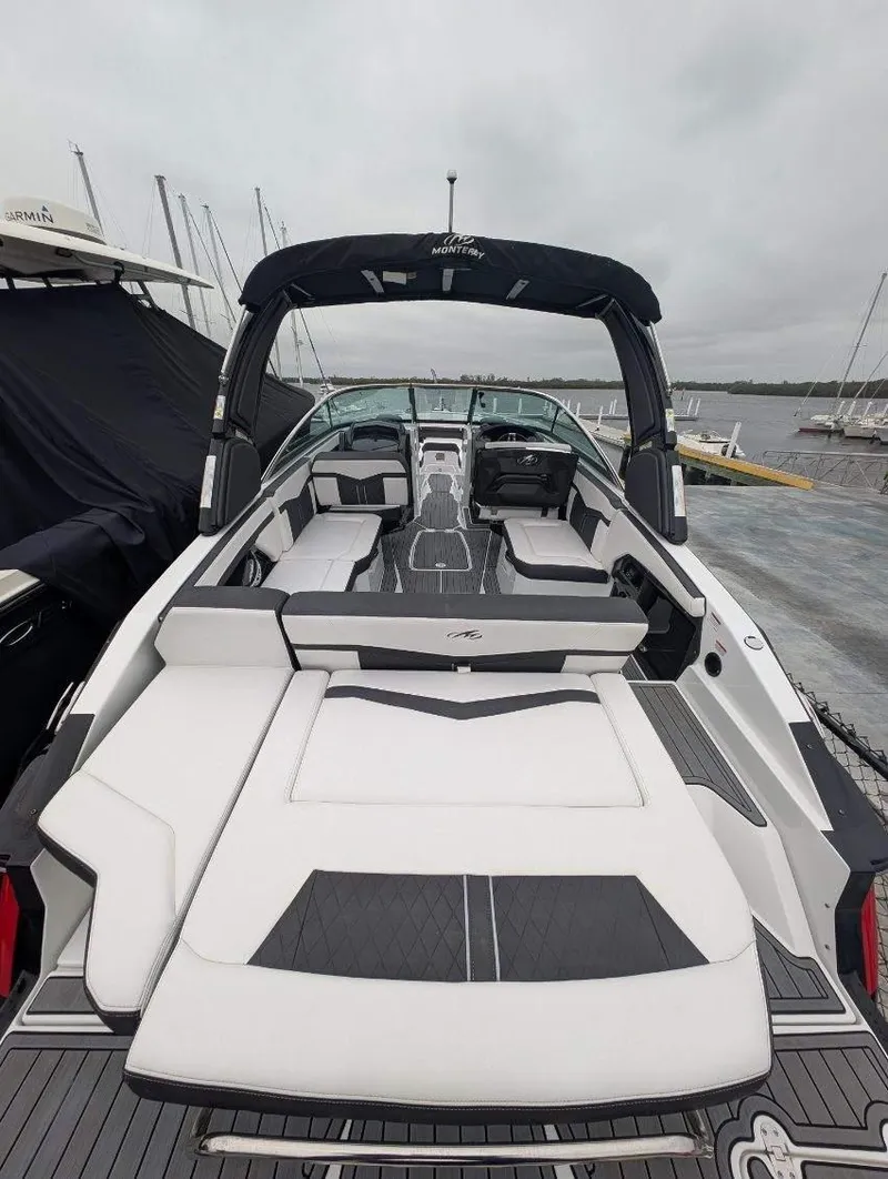 Slide: The Image of 2021 Monterey 275 Super Sport boat with sleek design, docked at marina. - 19