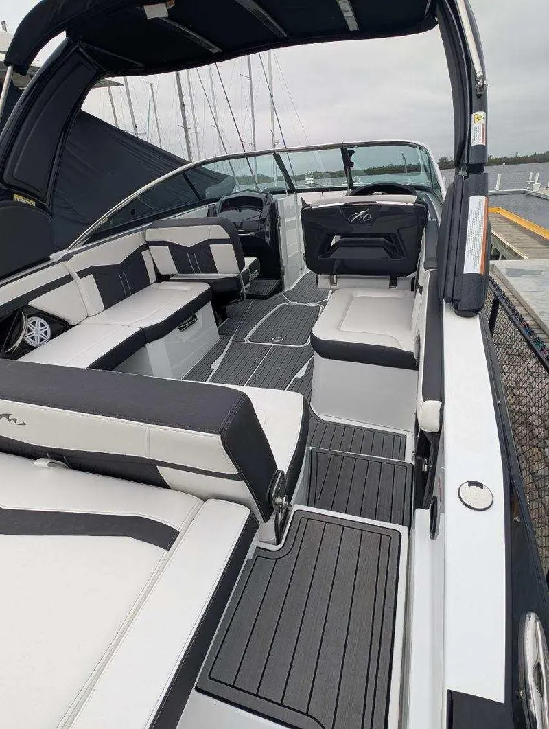 Slide: The Image of 2021 Monterey 275 Super Sport boat interior with sleek seating and modern design. - 20