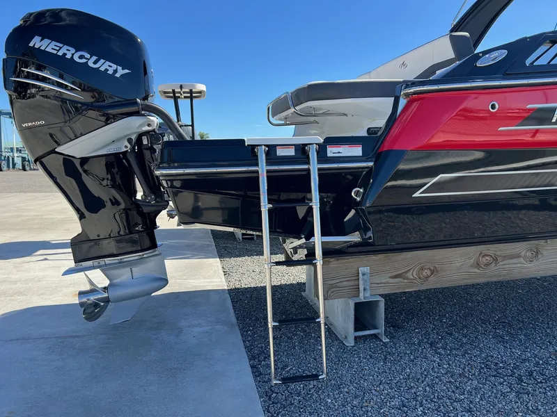 Slide: The Image of 2021 Monterey 275 Super Sport boat with Mercury outboard motor and swim ladder. - 7
