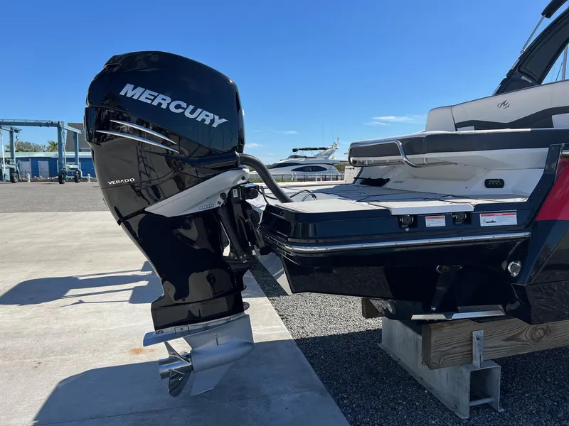 Slide: The Image of 2021 Monterey 275 Super Sport with Mercury outboard engine, docked on a sunny day. - 8