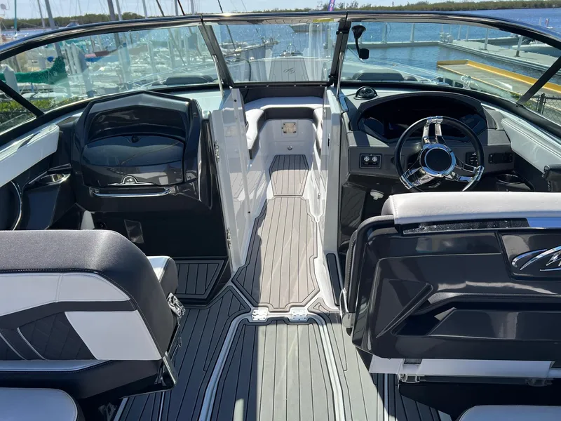 Slide: The Image of 2021 Monterey 275 Super Sport boat interior with sleek seating and modern dashboard. - 9