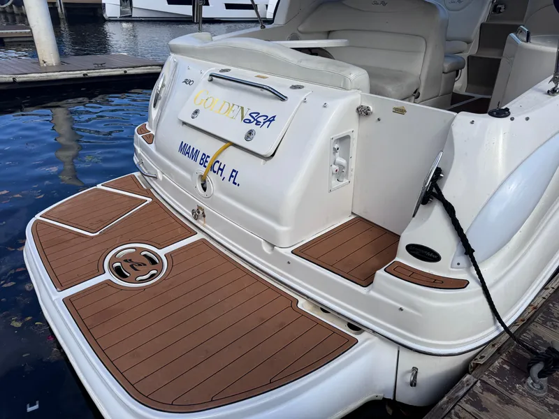 Slide: The Image of 2005 Sea Ray 280 Sundancer boat docked, featuring teak swim platform, Miami Beach, FL. - 15