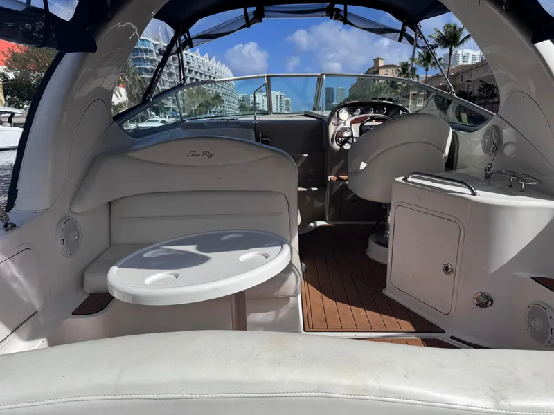 Slide: The Image of Interior of a 2005 Sea Ray 280 Sundancer boat with seating and steering area. - 16
