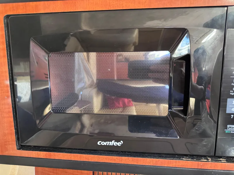 Slide: The Image of Microwave oven inside a 2005 Sea Ray 280 Sundancer boat kitchen area. - 37