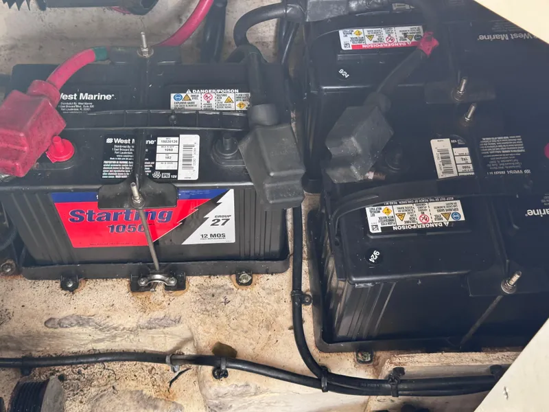 Slide: The Image of Batteries in a 2005 Sea Ray 280 Sundancer boat engine compartment. - 39