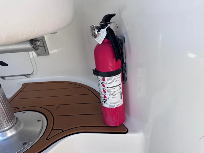 Slide: The Image of Red fire extinguisher mounted on a 2005 Sea Ray 280 Sundancer boat. - 40
