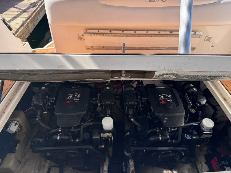 Slide: The Image of Twin engines of a 2005 Sea Ray 280 Sundancer boat, exposed for maintenance. - 42