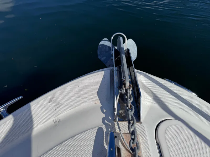 Slide: The Image of Bow of 2005 Sea Ray 280 Sundancer with anchor and chain in water. - 45