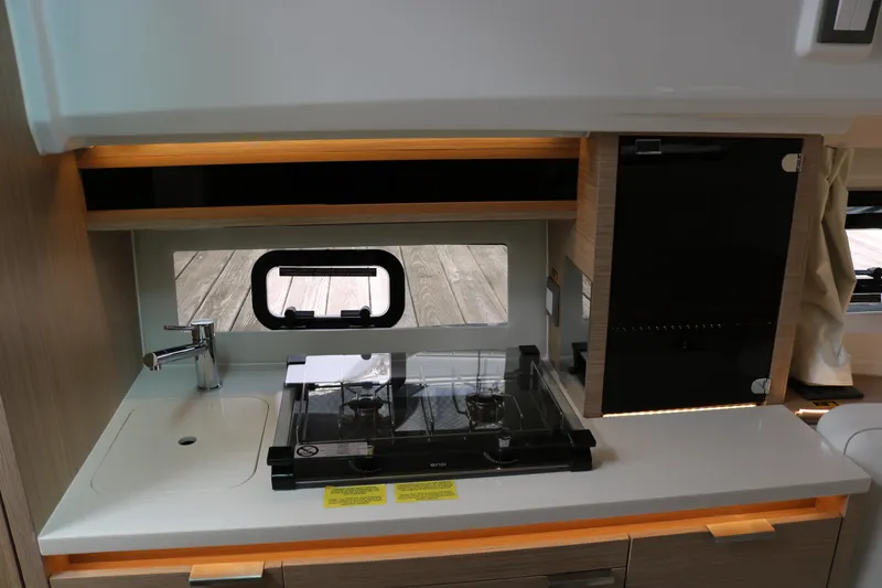 Slide: The Image of 2026 Jeanneau Leader 10.5 WA Series 2 yacht kitchen with stove and sink. - 21