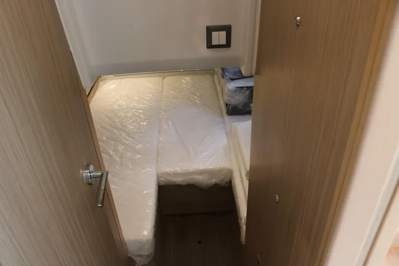 Slide: The Image of Interior cabin of 2026 Jeanneau Leader 10.5 WA Series 2 with bed and wooden finish. - 32