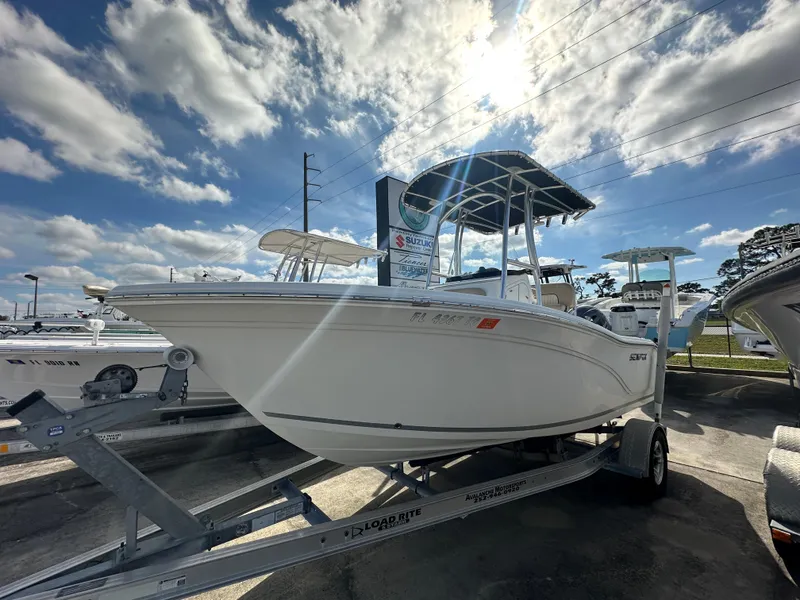 Slide: The Image of 2018 Sea Fox 186 Commander boat on trailer under a partly cloudy sky. - 1