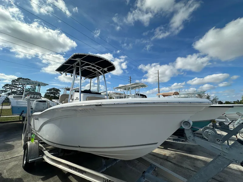 Slide: The Image of 2018 Sea Fox 186 Commander boat on trailer under blue sky with clouds. - 2