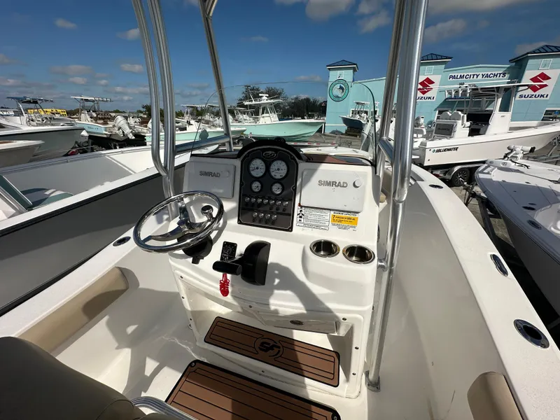 Slide: The Image of 2018 Sea Fox 186 Commander boat dashboard with steering wheel and controls. - 4