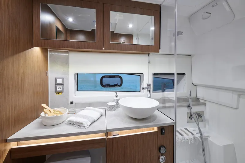 Slide: The Image of Luxurious bathroom interior of 2025 Jeanneau Leader 12.5 WA yacht, featuring modern fixtures and wood accents. - 15