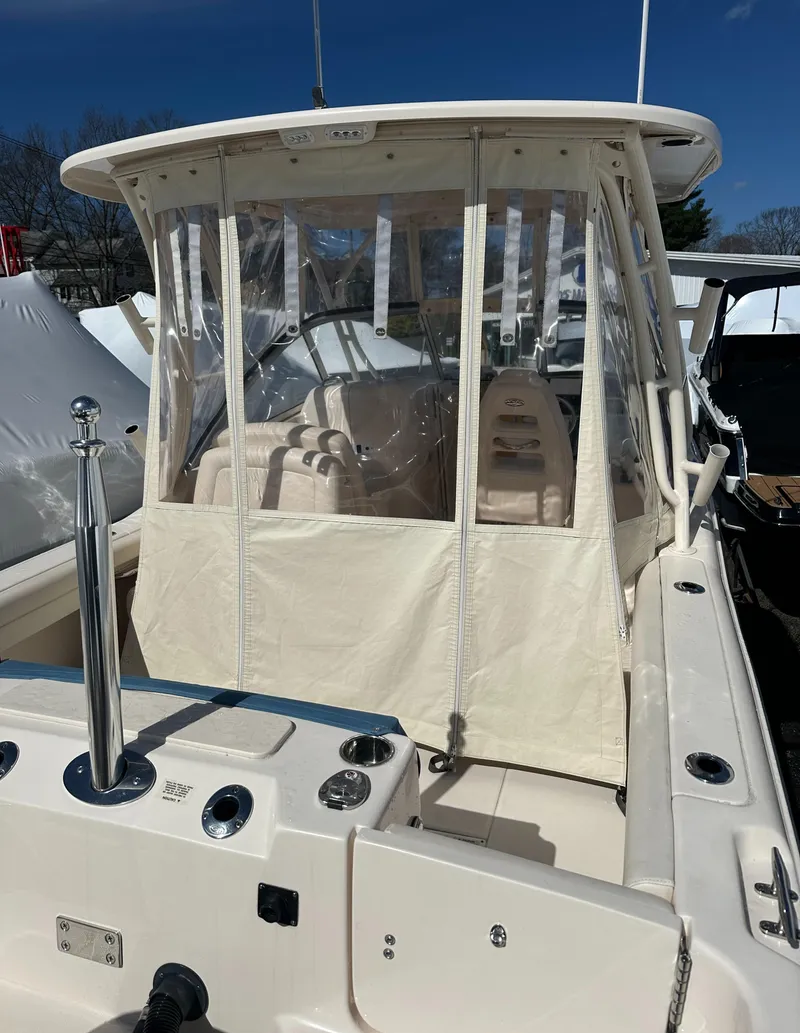 Slide: The Image of 2018 Grady-White Freedom 255 boat with enclosed cockpit and seating. - 13
