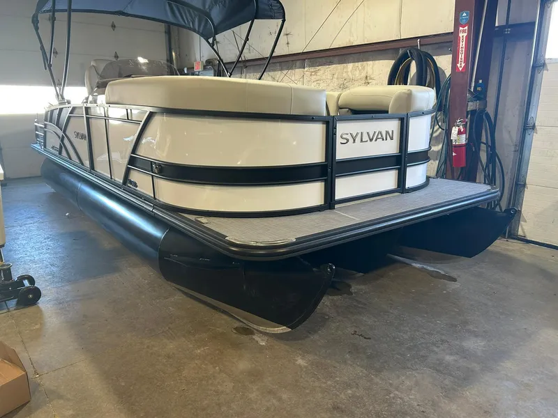 The Image of 2025 Sylvan Mirage X X3 CLZ pontoon boat in a garage setting. - 0