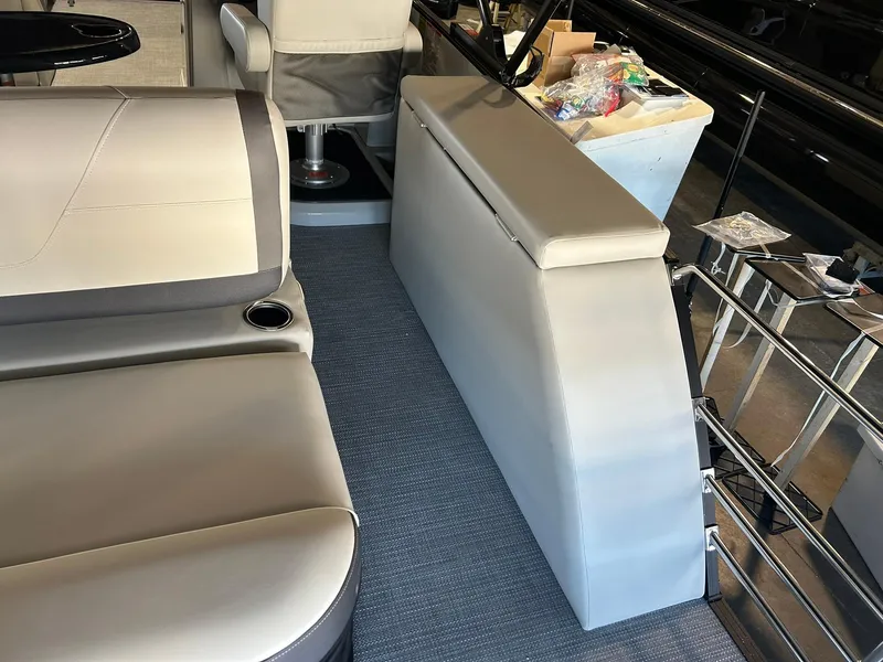 Slide: The Image of Interior of 2025 Sylvan Mirage X X3 CLZ boat with modern seating and storage. - 15