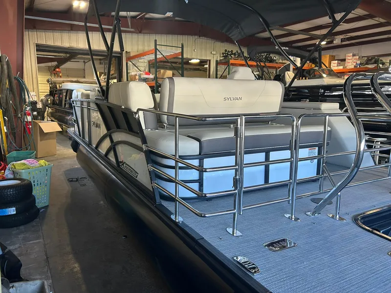 Slide: The Image of 2025 Sylvan Mirage X X3 CLZ pontoon boat in a showroom setting. - 16