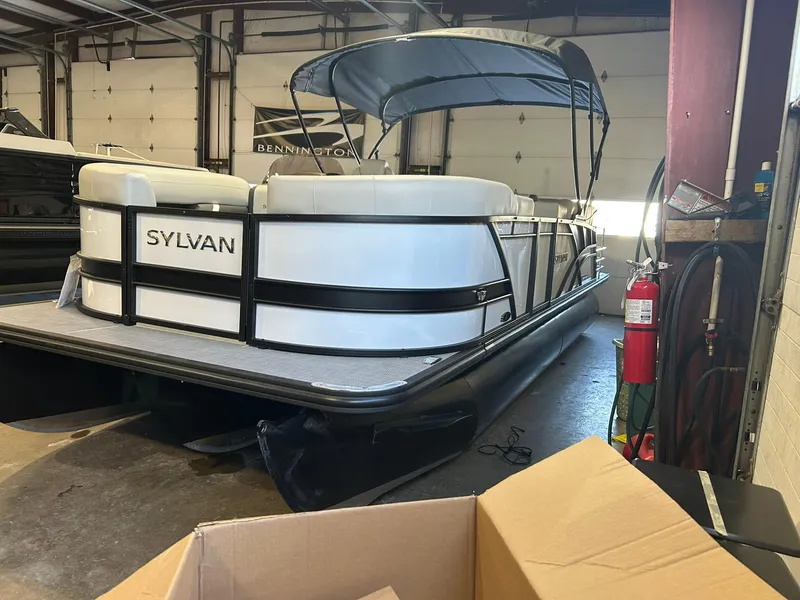Slide: The Image of 2025 Sylvan Mirage X X3 CLZ pontoon boat in a garage setting. - 3