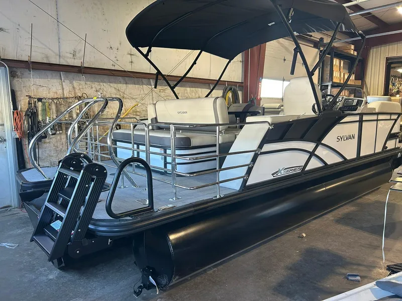 Slide: The Image of 2025 Sylvan Mirage X X3 CLZ pontoon boat in a warehouse setting. - 5