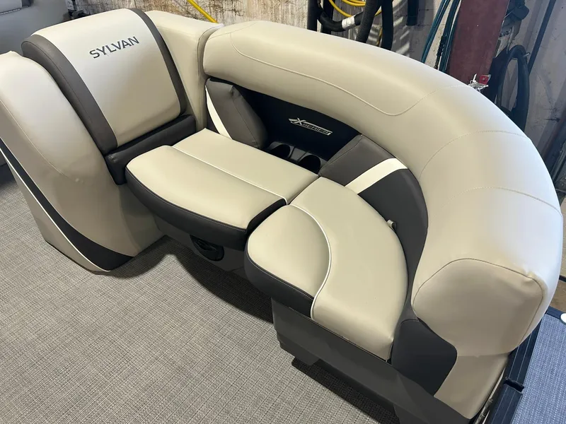 Slide: The Image of 2025 Sylvan Mirage X X3 CLZ boat seating, featuring luxurious beige and gray upholstery. - 8