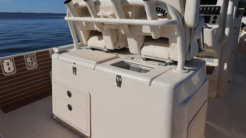 Slide: The Image of 2023 Grady-White 281 Coastal Explorer boat interior with seating and storage. - 14