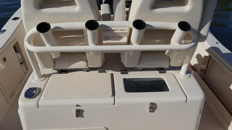 Slide: The Image of 2023 Grady-White 281 Coastal Explorer boat with rod holders and storage compartments. - 15