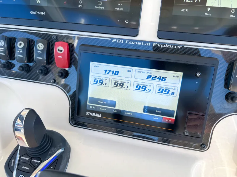 Slide: The Image of Dashboard of 2023 Grady-White 281 Coastal Explorer with Yamaha display and controls. - 23