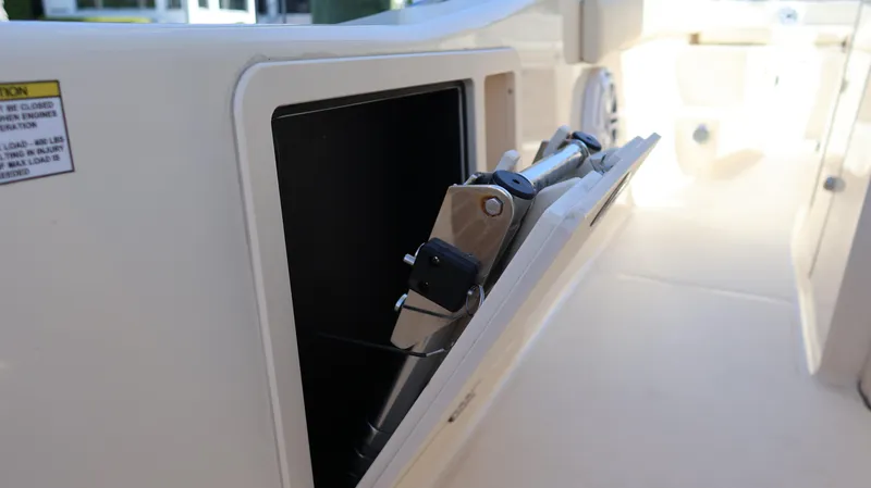 Slide: The Image of 2023 Grady-White 281 Coastal Explorer storage compartment detail. - 27
