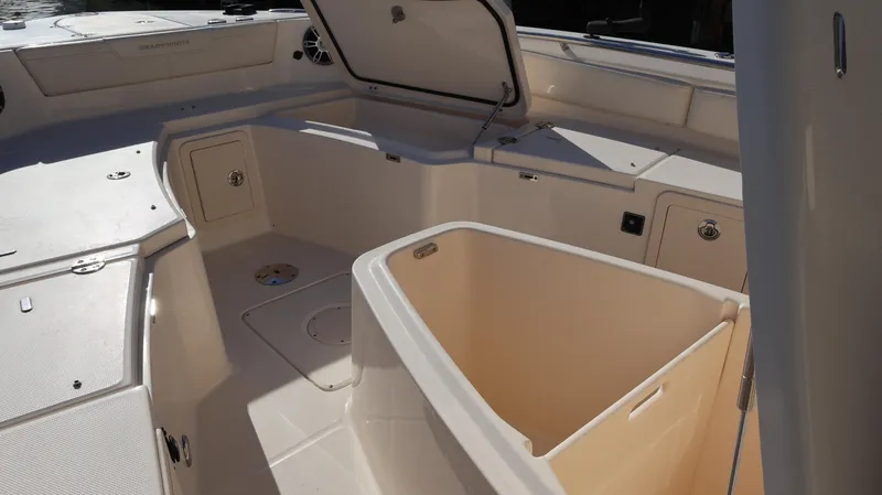 Slide: The Image of 2023 Grady-White 281 Coastal Explorer boat interior with open storage compartments. - 30