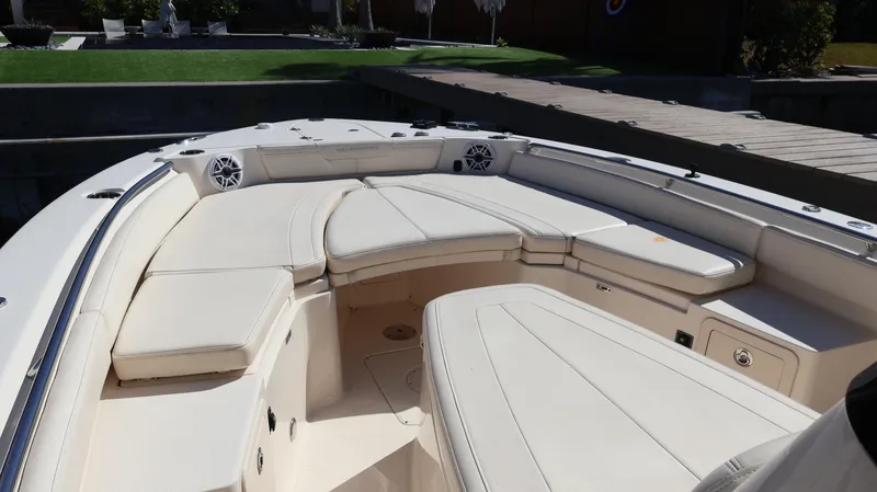 Slide: The Image of 2023 Grady-White 281 Coastal Explorer boat interior with cushioned seating. - 39