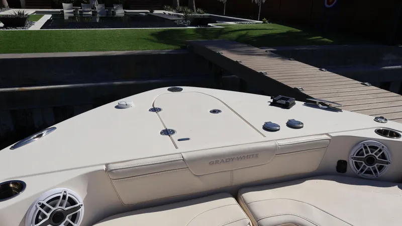 Slide: The Image of 2023 Grady-White 281 Coastal Explorer boat deck with seating and speakers. - 40