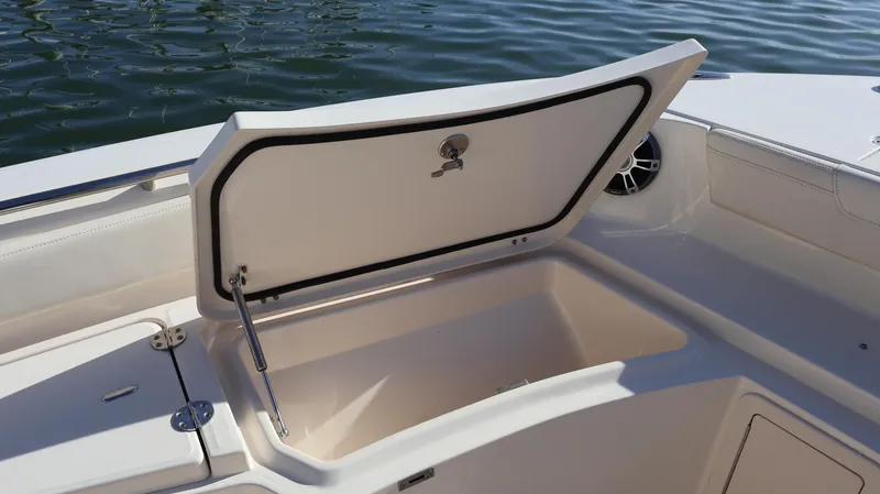 Slide: The Image of 2023 Grady-White 281 Coastal Explorer boat storage compartment open on deck. - 42