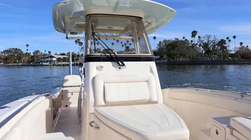 Slide: The Image of 2023 Grady-White 281 Coastal Explorer boat on calm water, featuring sleek design and spacious deck. - 44
