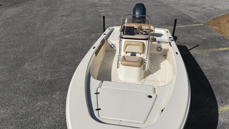 Slide: The Image of 2022 Scout 177 Sport boat, beige interior, parked on asphalt. - 5