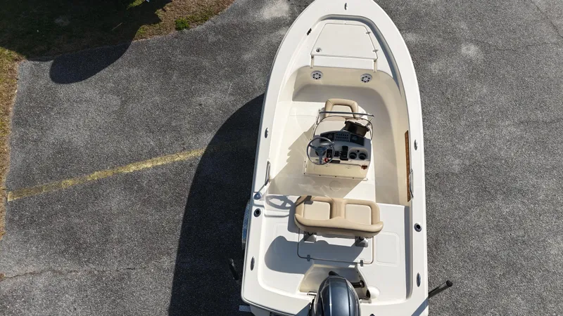 Slide: The Image of 2022 Scout 177 Sport boat, aerial view, parked on pavement. - 7