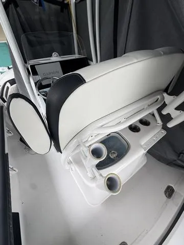 Slide: The Image of 2024 Tidewater 2300 Carolina Bay boat interior with seating and console details. - 12