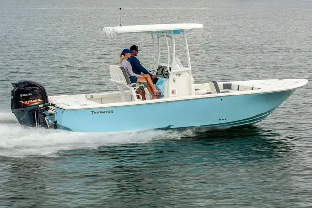 Slide: The Image of 2024 Tidewater 2300 Carolina Bay boat cruising on water with passengers. - 18