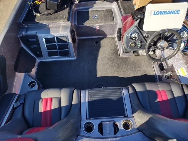 Slide: The Image of 2012 Ranger Z519 Comanche boat interior with steering wheel and seating. - 2