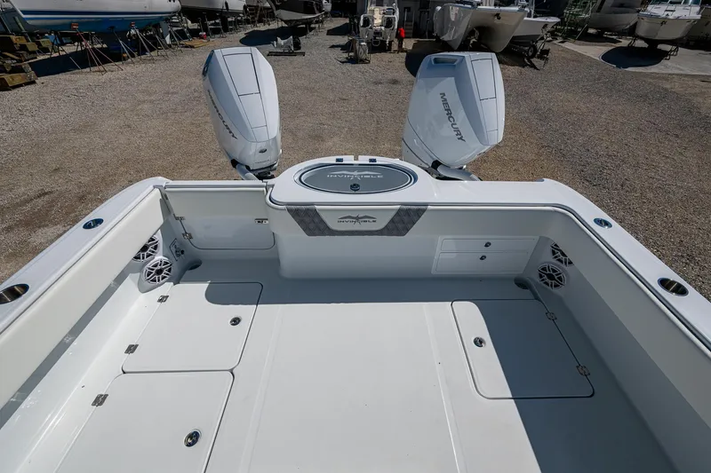 Slide: The Image of 2025 Invincible 33 Catamaran with twin outboard motors, spacious deck, and modern design. - 15