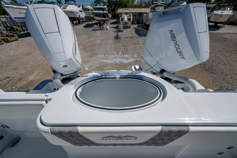 Slide: The Image of 2025 Invincible 33 Catamaran with Mercury engines, featuring a sleek design and spacious deck. - 16