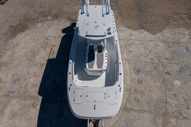 Slide: The Image of 2025 Invincible 33 Catamaran, aerial view showcasing sleek design and spacious deck layout. - 2
