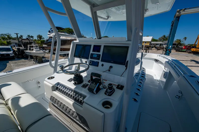 Slide: The Image of 2025 Invincible 33 Catamaran cockpit with advanced navigation controls and sleek design. - 27
