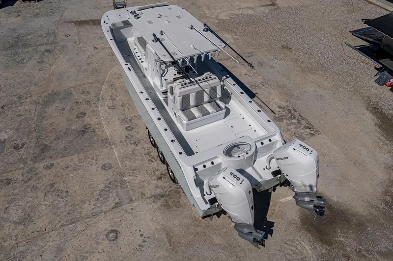 Slide: The Image of 2025 Invincible 33 Catamaran with dual engines, aerial view on concrete surface. - 38