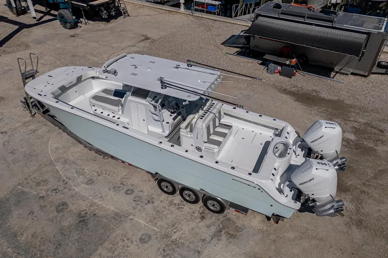 Slide: The Image of 2025 Invincible 33 Catamaran with dual engines on a trailer, aerial view. - 39