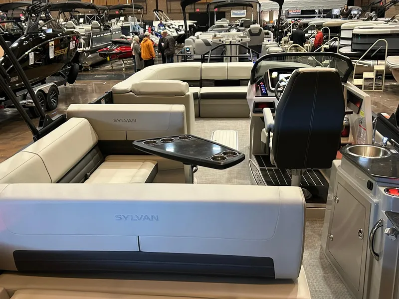 Slide: The Image of 2025 Sylvan G5 CLZ pontoon boat interior with seating and control console. - 11