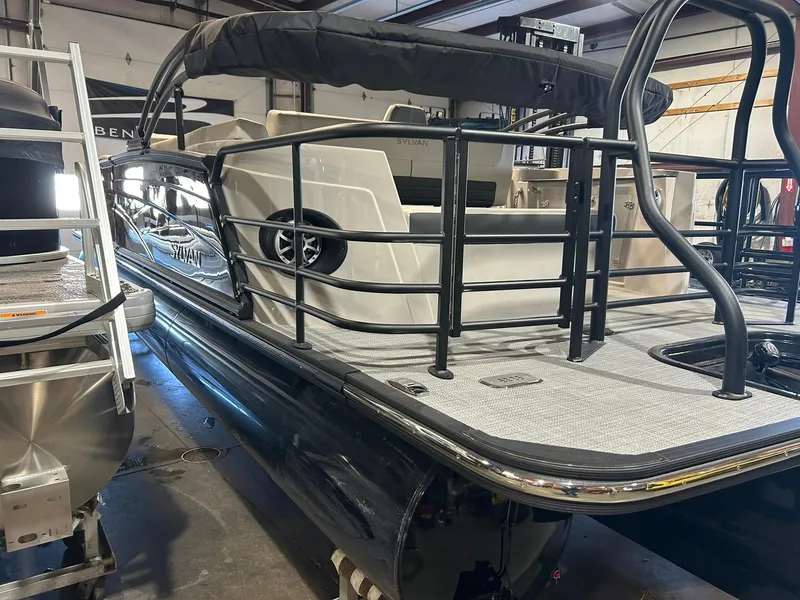 Slide: The Image of 2025 Sylvan G5 CLZ pontoon boat in showroom, featuring sleek design and modern amenities. - 16