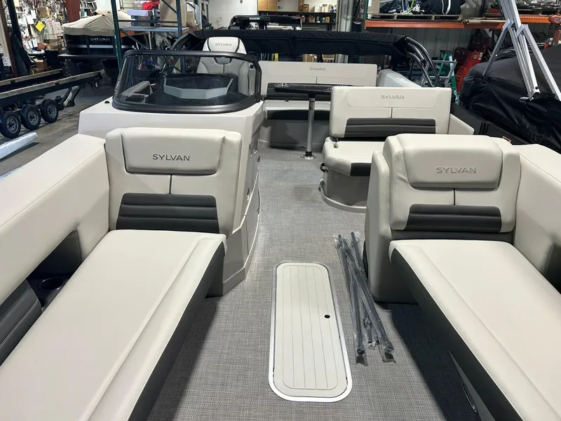 Slide: The Image of 2025 Sylvan G5 CLZ boat interior with beige seating and modern design. - 4