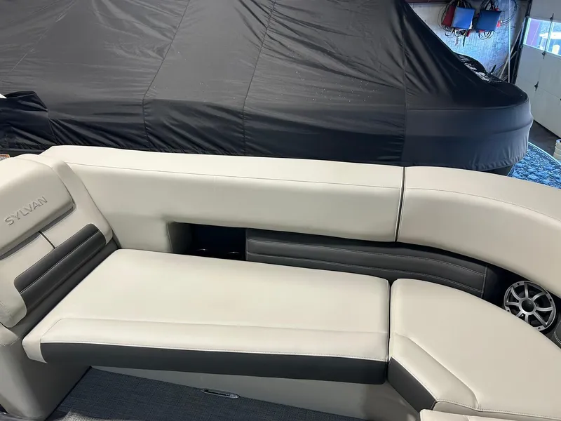 Slide: The Image of 2025 Sylvan G5 CLZ boat interior with beige and black seating. - 6