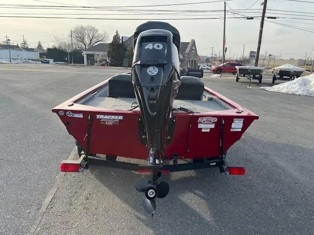 Slide: The Image of 2023 Tracker Pro 170 boat with 40 HP motor, parked on pavement. - 4